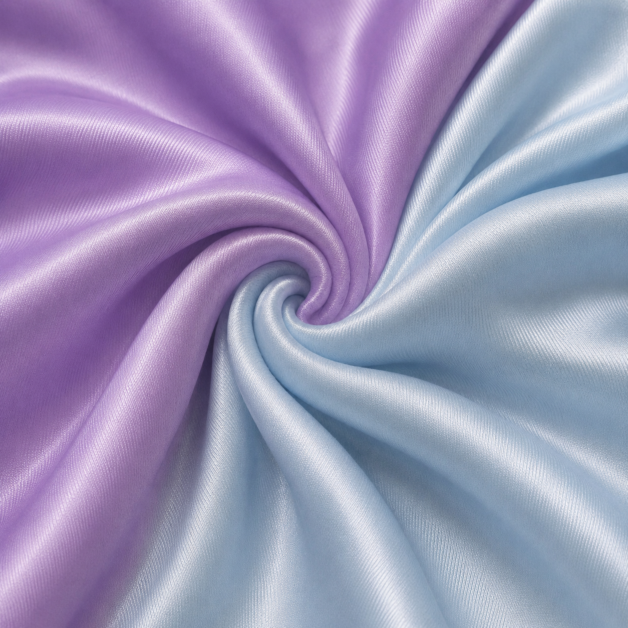 Close-up of purple and baby blue satin fabric used for the Estrella Swim Ursula reversible cheeky bikini bottom.
