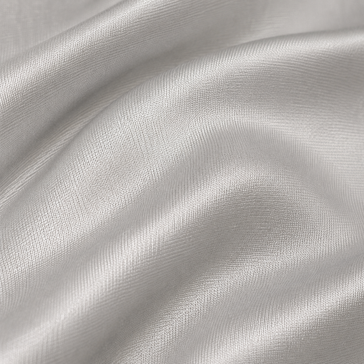 Close-up of silver metallic satin fabric from the Estrella Swim Astra triangle bikini set.