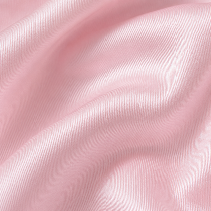 Close-up of baby pink satin fabric from the Estrella Swim Nena bikini set.