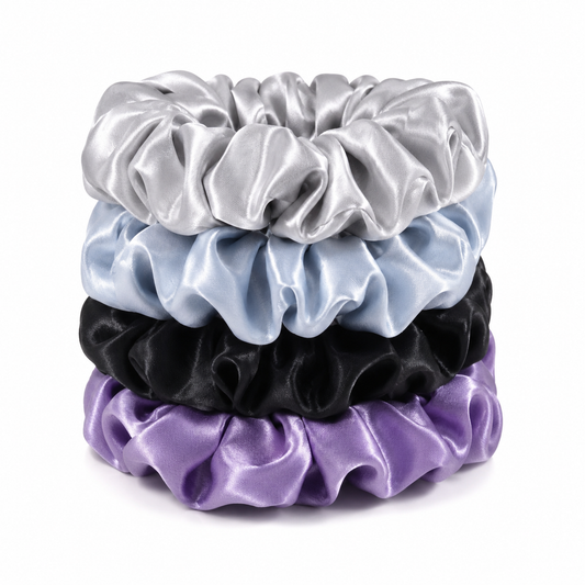 Estrella Swim luxury satin hair scrunchies in silver, baby blue, black, and purple.