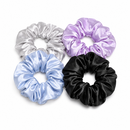 Estrella Swim luxury satin hair scrunchies in silver, baby blue, black, and purple.